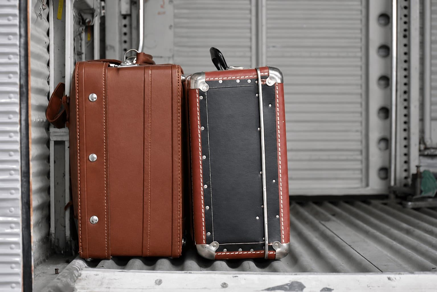 Vintage leather suitcases — worn, traveled, full of character